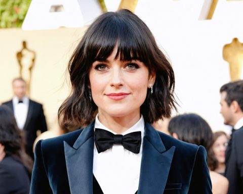 Zooey Deschanel Sparks Reunion Buzz with Tuxedo Glamour at SAG Awards Zooey Deschanel Sparks Reunion Buzz with Tuxedo Glamour at SAG Awards